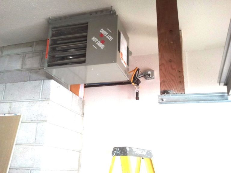 Install a garage heater with a gas line and vent pipe in a residential garage.